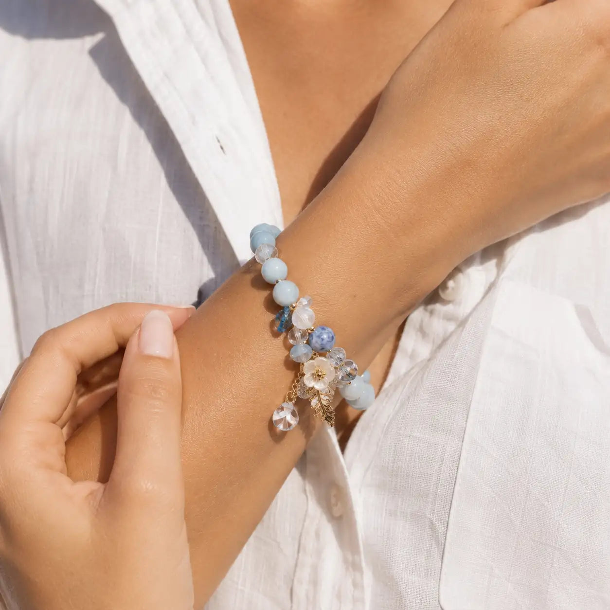 Blue crystal flower bracelet detail image with floral charm by TheFuMaster