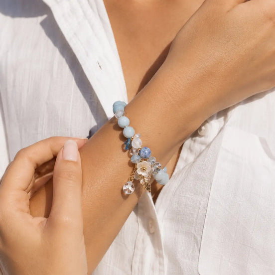Blue crystal flower bracelet worn on the wrist