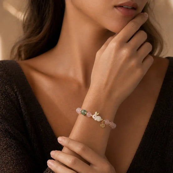 Bunny rose quartz bracelet worn on the hand