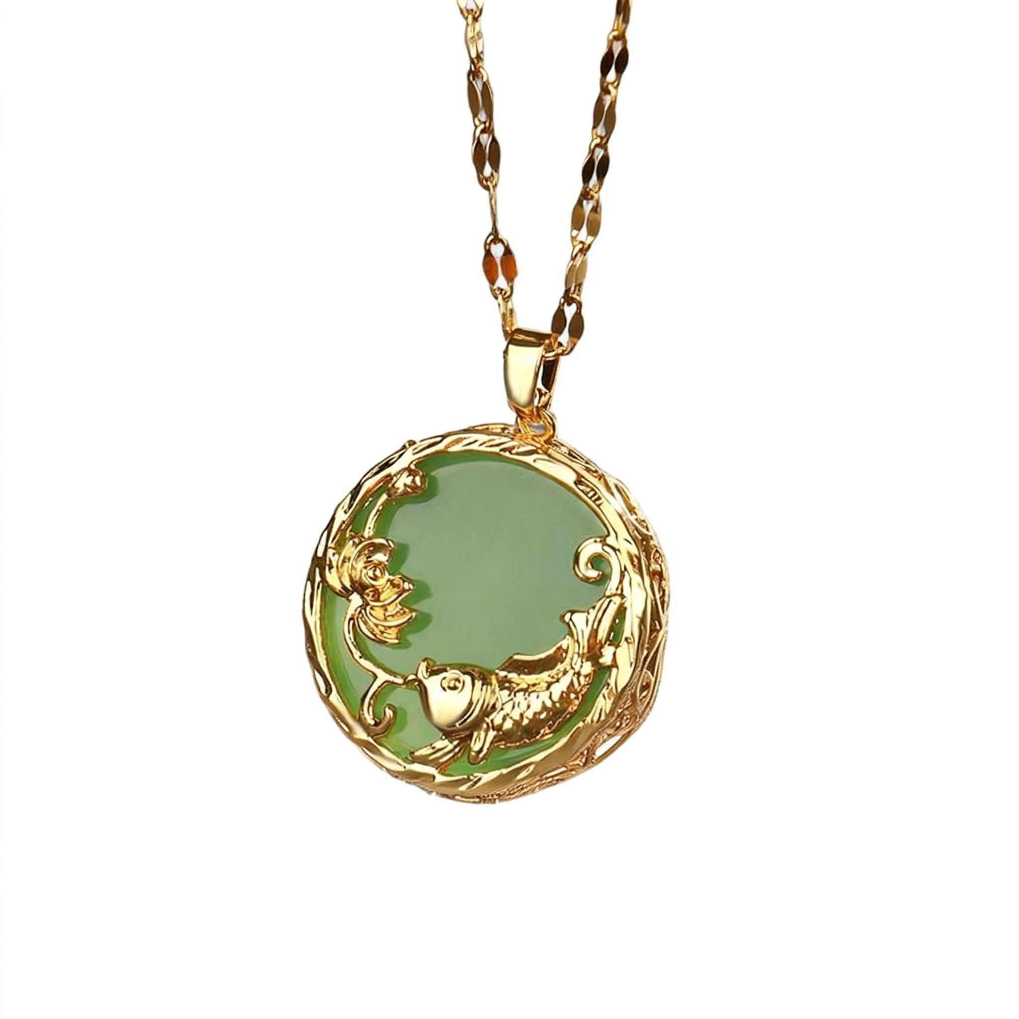 Gold necklace with a green pendant on a white background