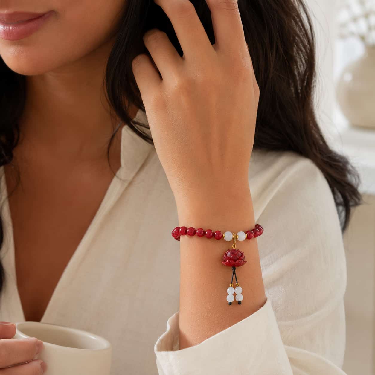 Close-up of Cinnabar Lotus Protection Bracelet with cinnabar and lotus