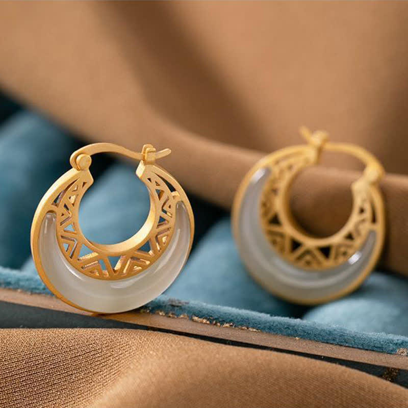 Pair of Crescent Moon Jade Earrings showing smooth jade texture and refined gold details | TheFuMaster