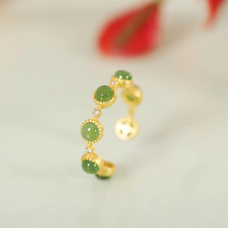 Close-up of Cyan Jade Healing Ring under soft light showcasing its natural gloss and energy reflection | TheFuMaster