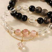 Dark and light obsidian crystal bracelet shown from another angle