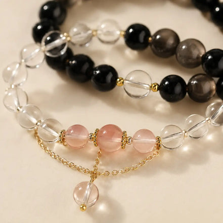 Dark and light obsidian crystal bracelet shown from another angle