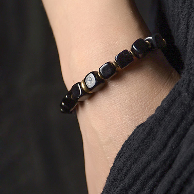 Dark Guard Black Obsidian Brass Pipe Bracelet worn on left wrist