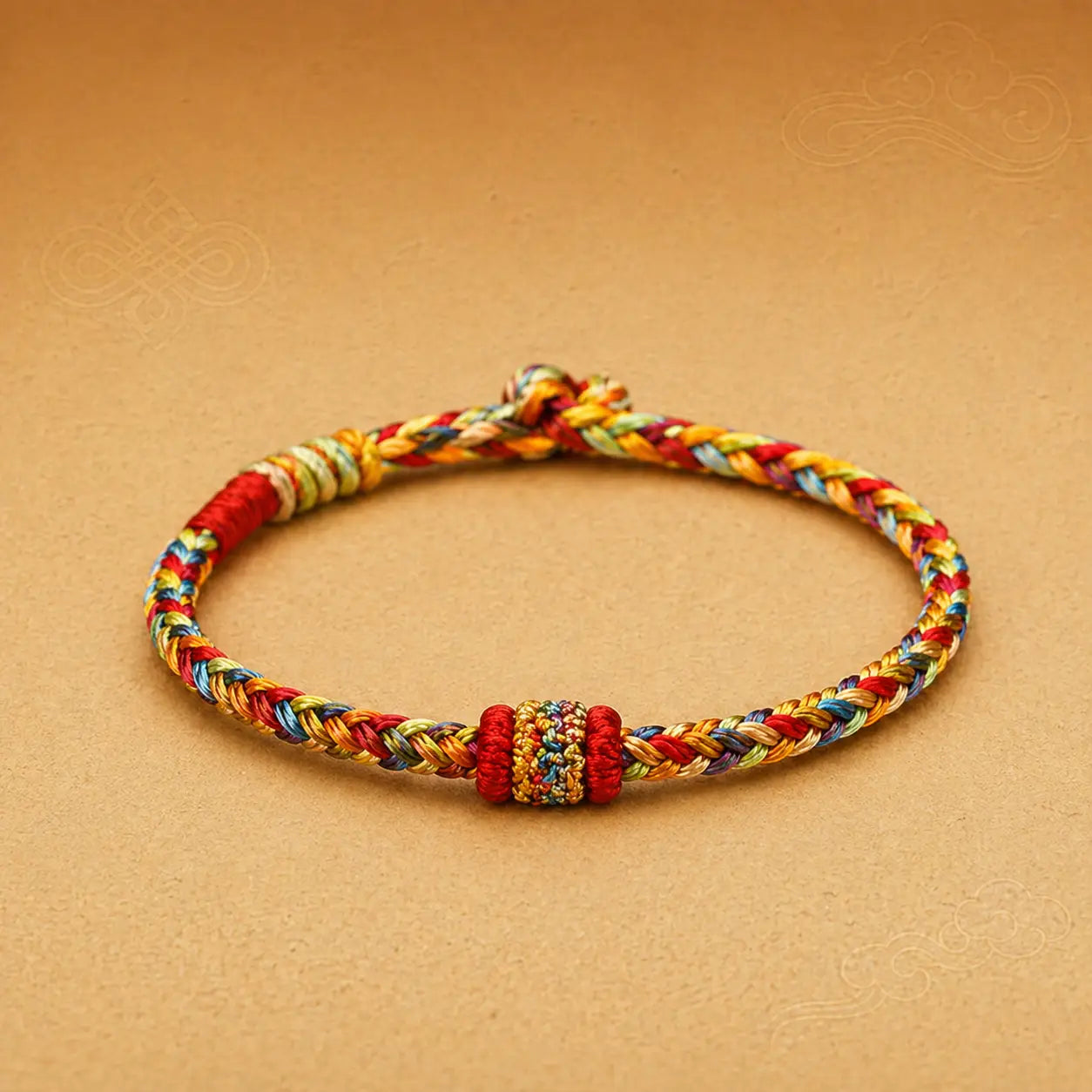 Colorful braided bracelet on a beige background