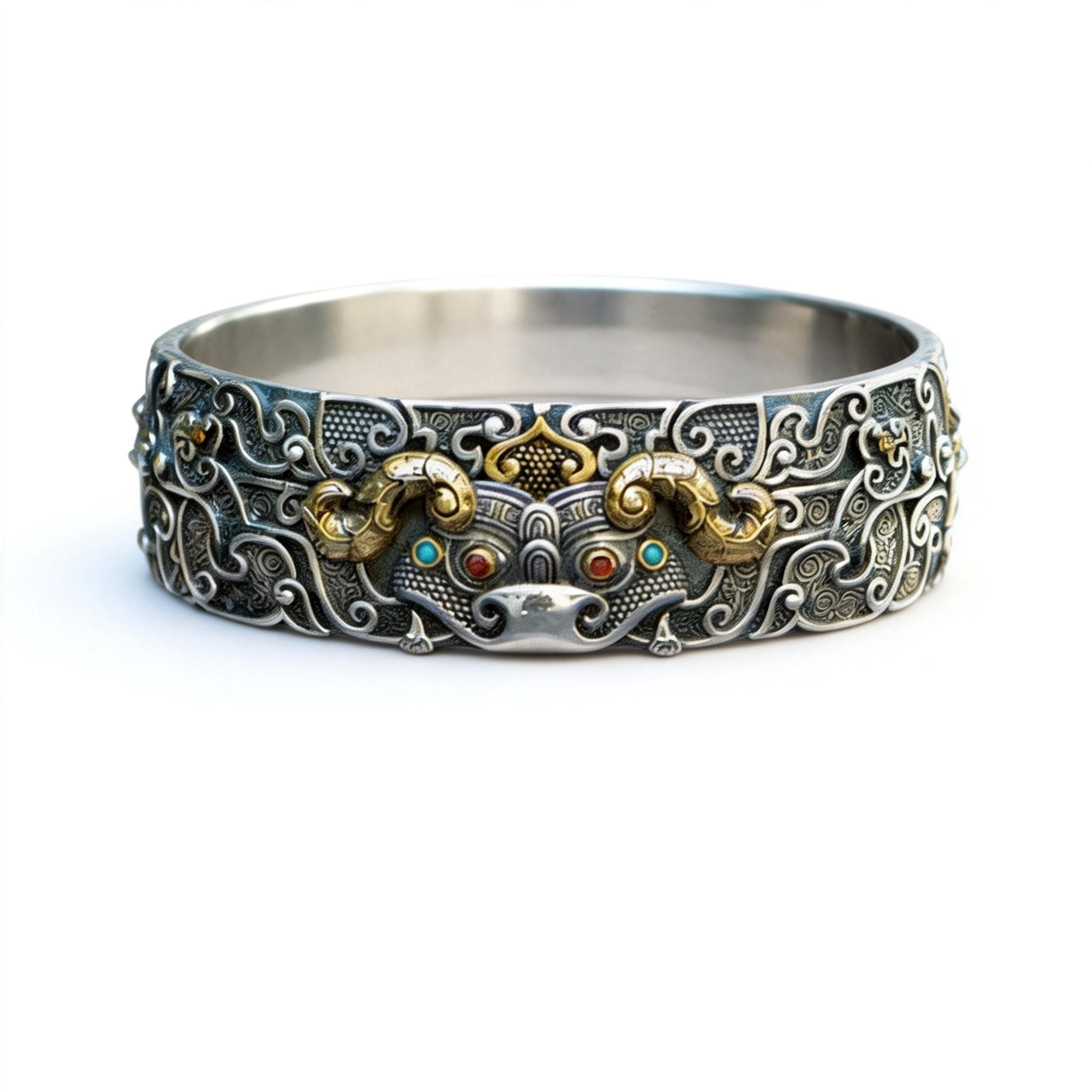 Decorative silver bracelet with intricate designs on a white background