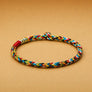 Colorful braided dog collar on a beige background