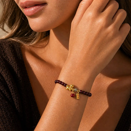 Close-up of Garnet Horse Charm Bracelet with garnet