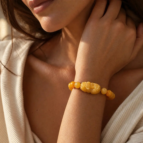 Golden pixiu jade bracelet worn on the wrist