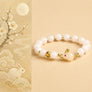 Golden Silk Jade Cute Rabbit Good Luck Bracelet with white beads, gold accents, and rabbit symbolism by TheFuMaster