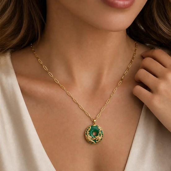 Green jade dragon pendant worn as a necklace