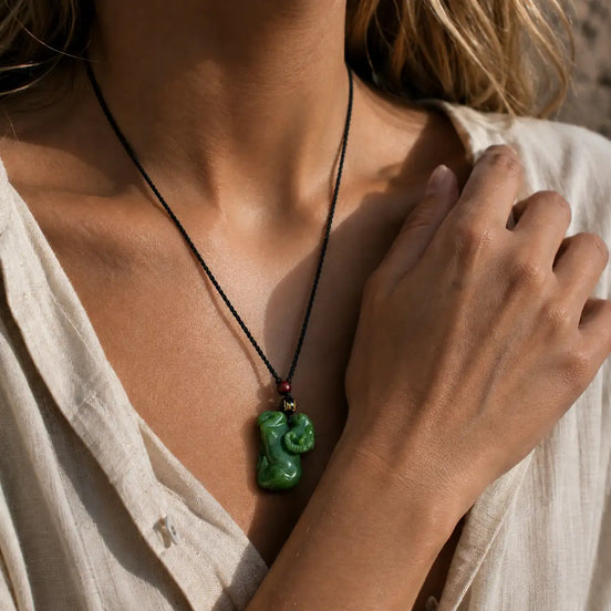 Green jade goat pendant display