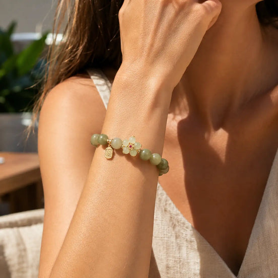 Green stone Fu charm bracelet worn on the wrist