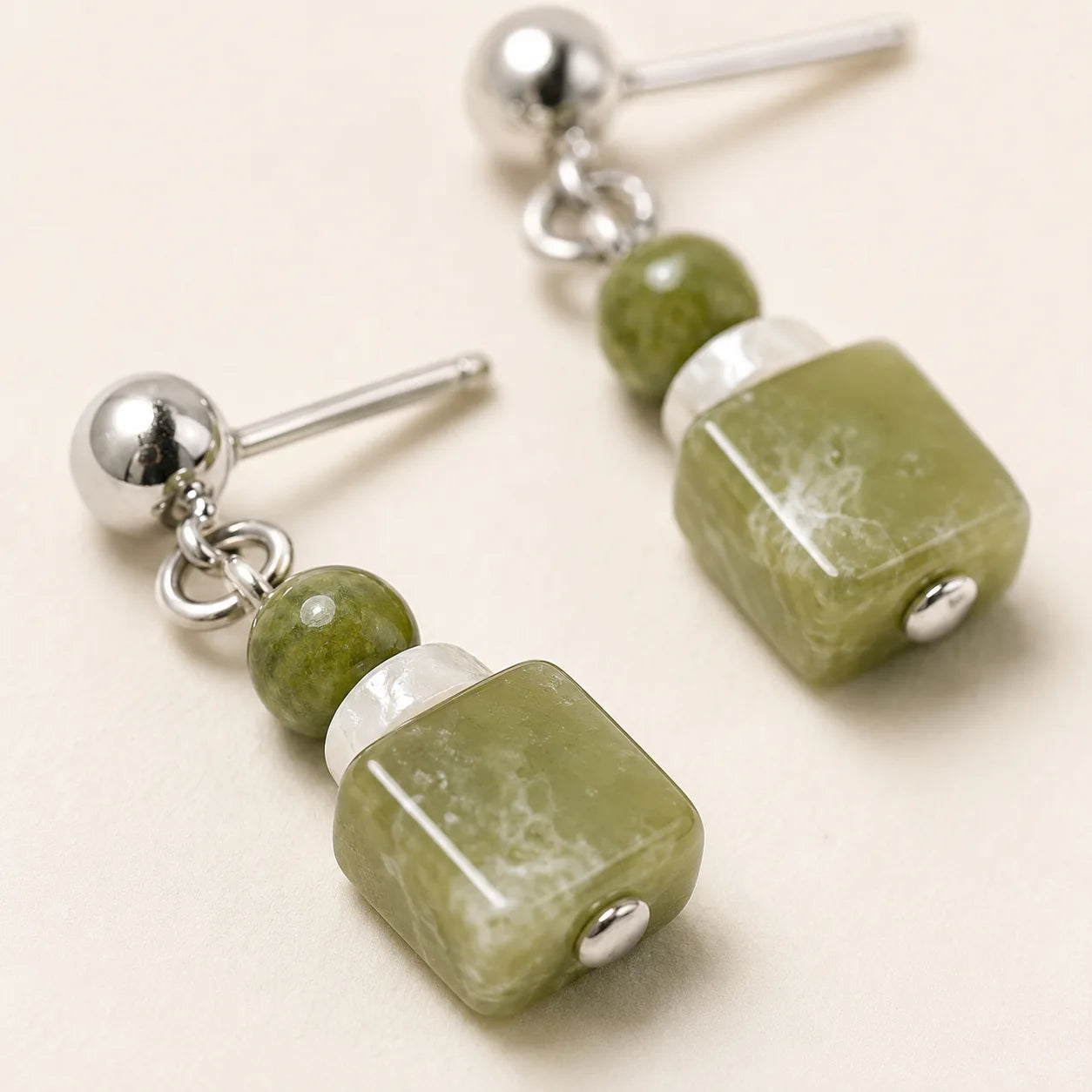 Green Xiuyan Jade Shell Stud Earrings shown from another angle with green jade
