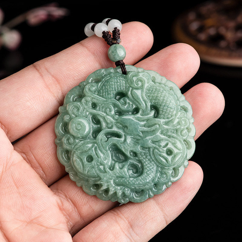 Imperial Pulse Jade Dragon Pendant held in hand showing carved green jade texture