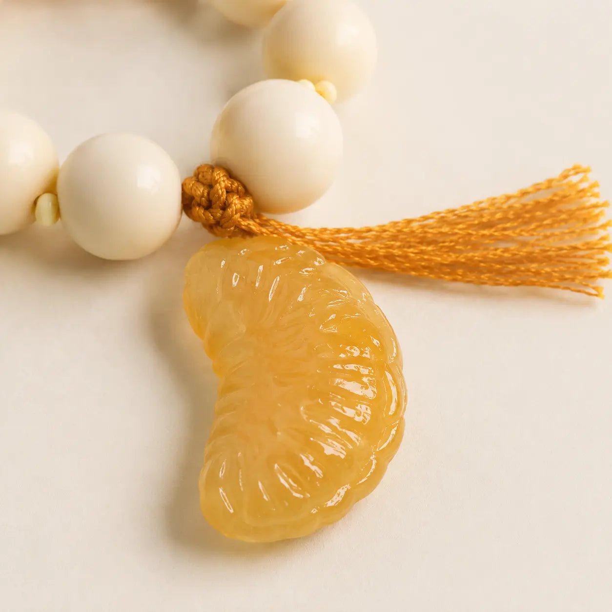 Ivory Nut Orange Slice Handheld Beads detail view