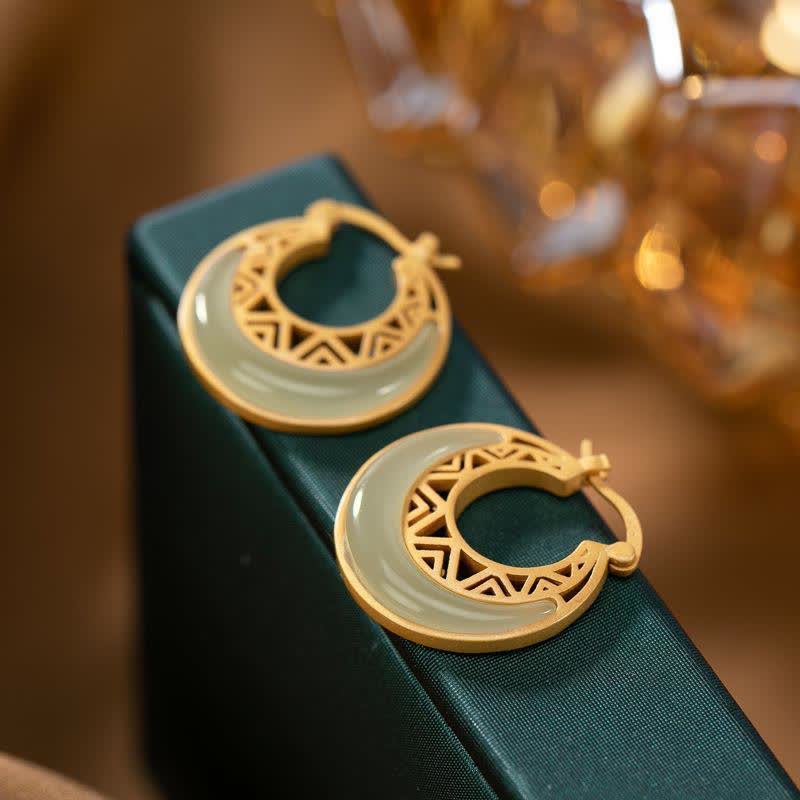 Crescent Moon Jade Drop Earrings displayed on jewelry box