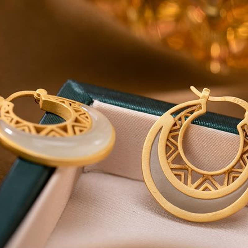 Close-up of Crescent Moon Jade Drop Earrings showing polished craftsmanship
