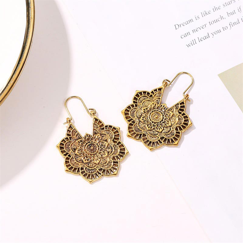 Side view of Lotus Engraving Copper Drop Earrings highlighting detailed craftsmanship and elegant symmetry