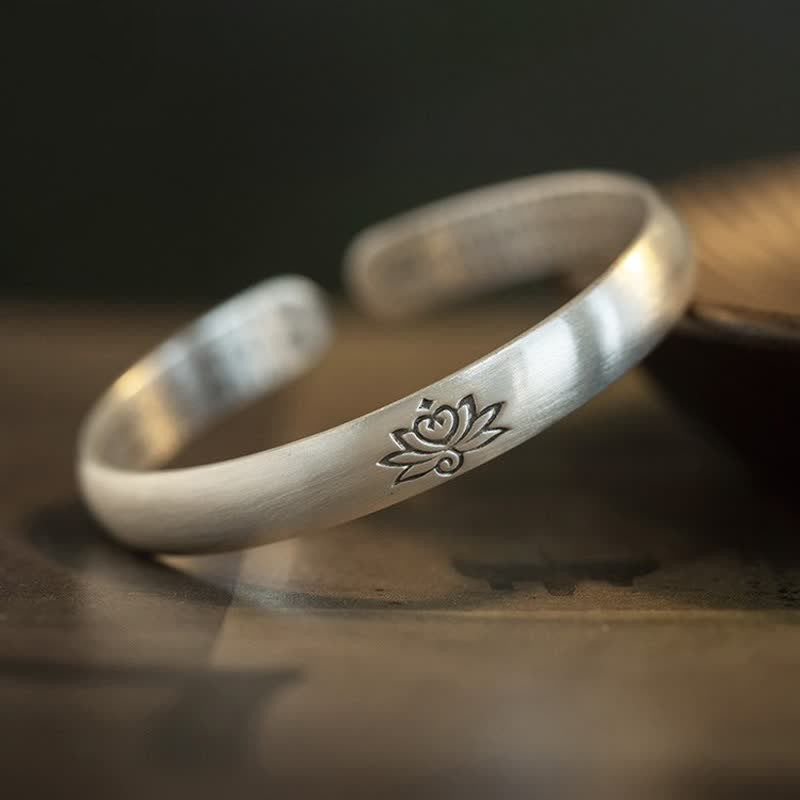 Lotus Engraved Silver Bangle by TheFuMaster showcasing calm and elegant craftsmanship
