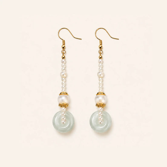 Peace buckle pearl drop earrings by TheFuMaster