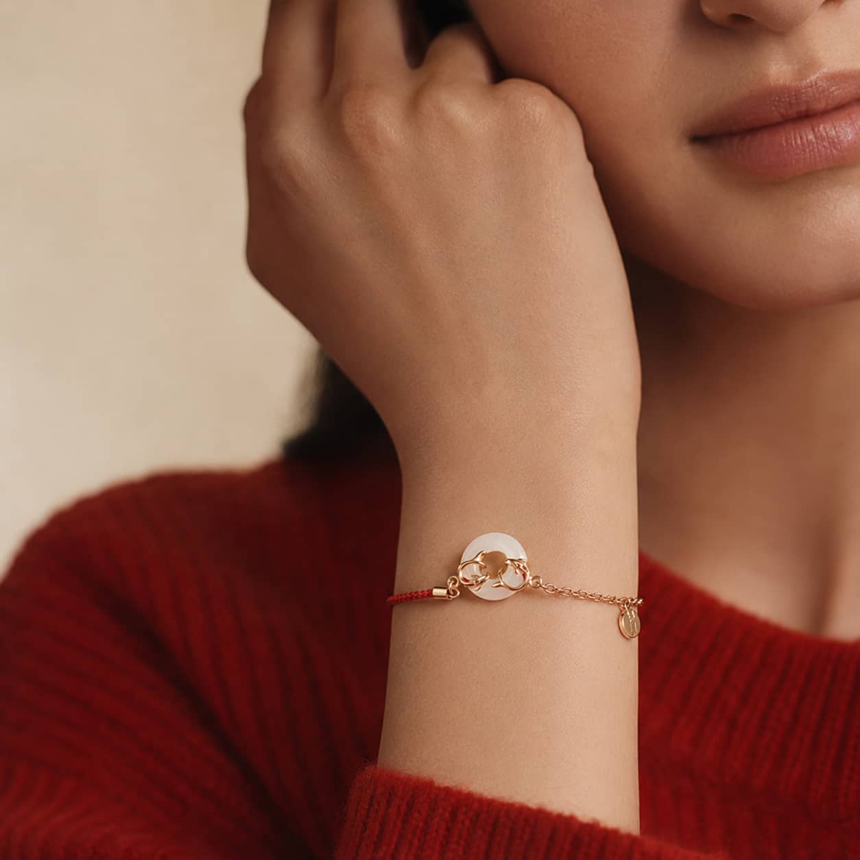 Close-up of Peace Koi Red String Bracelet with red string and koi