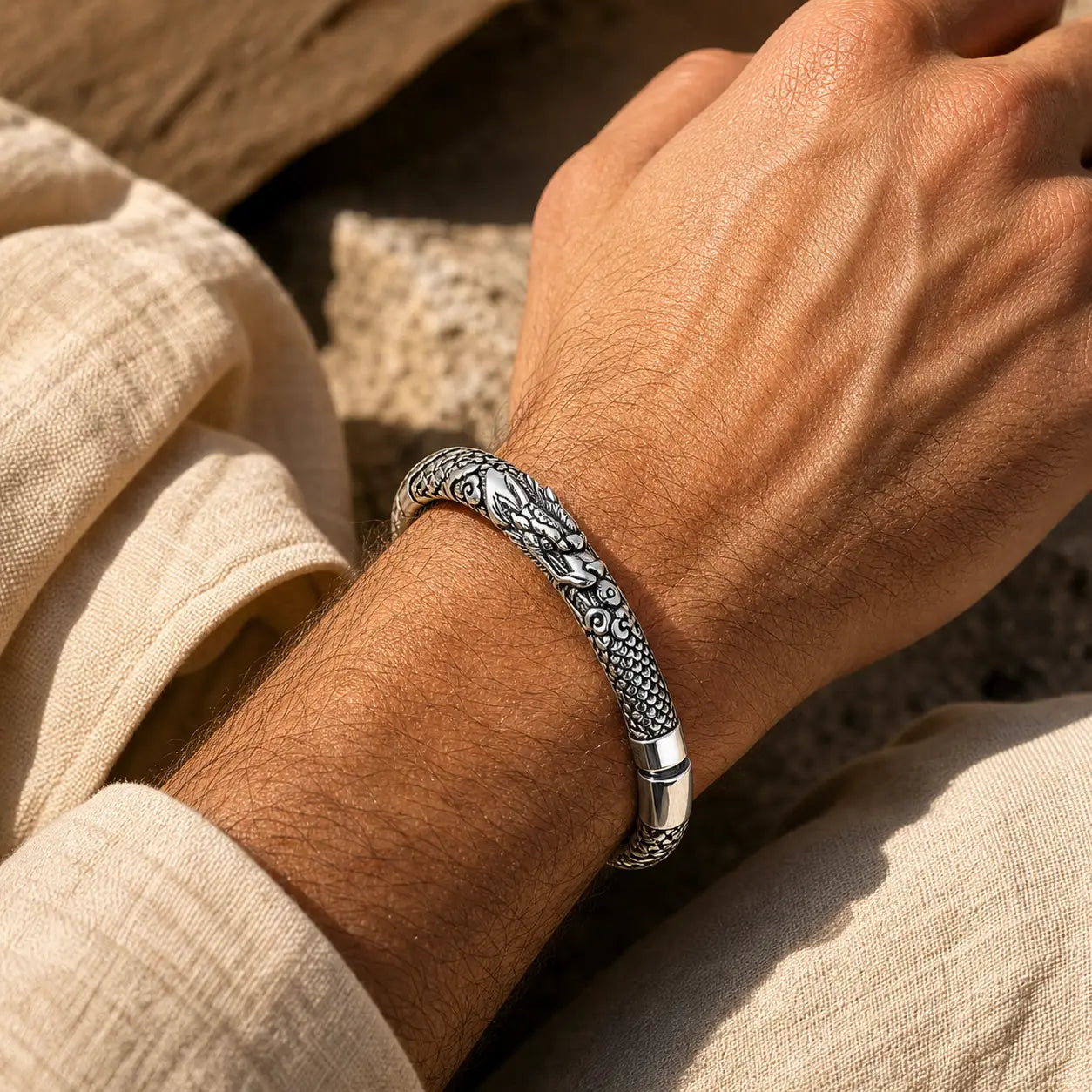 Rising Cloud Relief Cuff Bracelet worn as a silver statement cuff