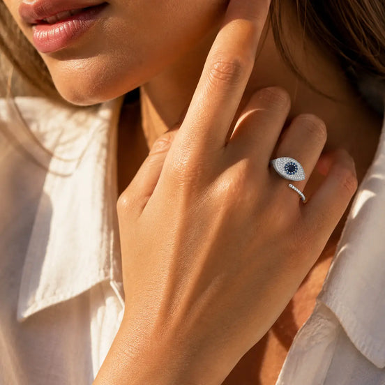 Silver evil eye open ring worn on the hand