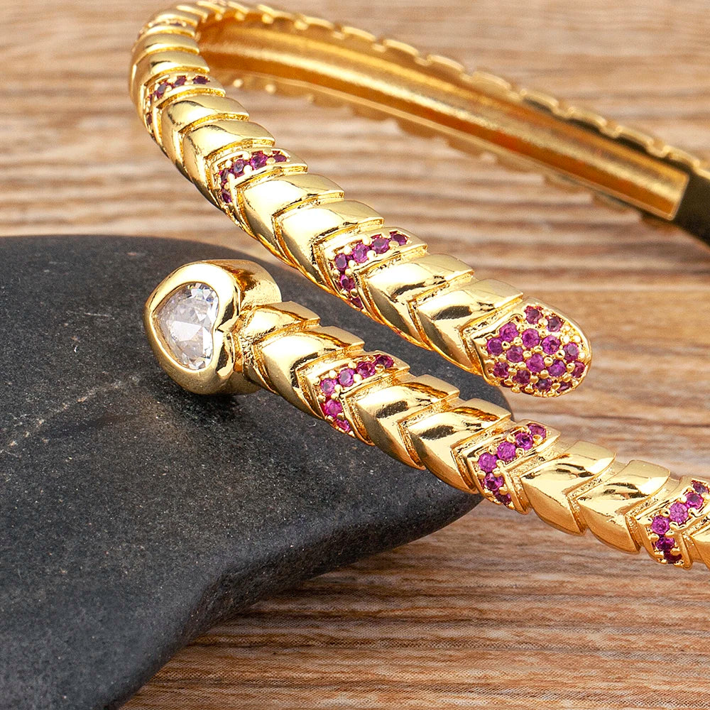 Detail view of Coiled Grace Snake Zircon Gold Cuff Bracelet with gemstone accents