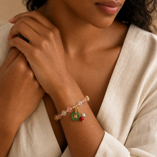 Strawberry quartz Fu bracelet worn on the wrist