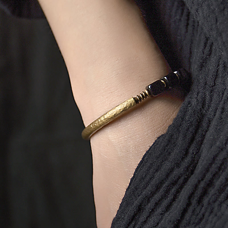 Lifestyle photo – Black Obsidian Copper Bracelet by TheFuMaster for protection and cleansing
