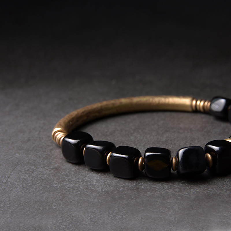 Close-up of handcrafted Black Obsidian and Brass detail – TheFuMaster energy jewelry
