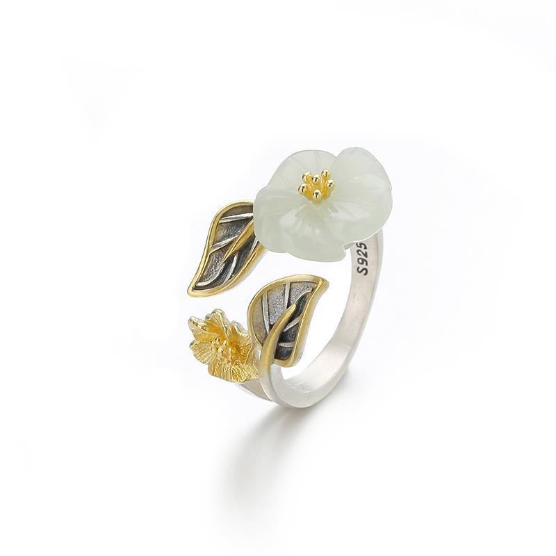 Model portrait wearing the White Jade Plum Flower Leaf Ring, radiating confidence and calm
