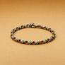 Multicolored braided bracelet on a beige background
