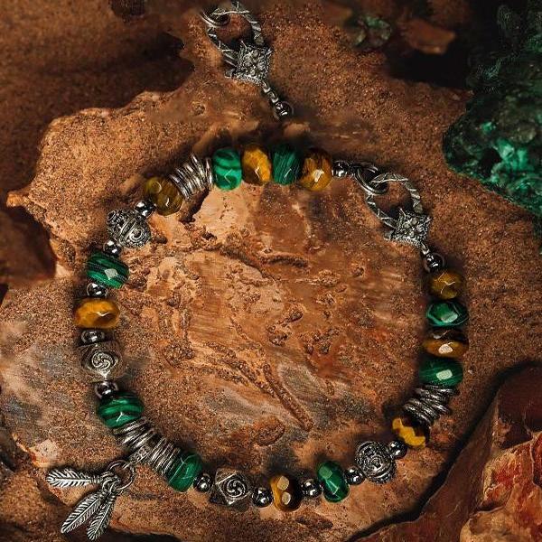 Close-up of Retro Tiger Eye Sovereign Bracelet with green and yellow beads