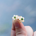 Pair of White Jade Flower Stud Earrings symbolizing harmony and gentle blessings | TheFuMaster