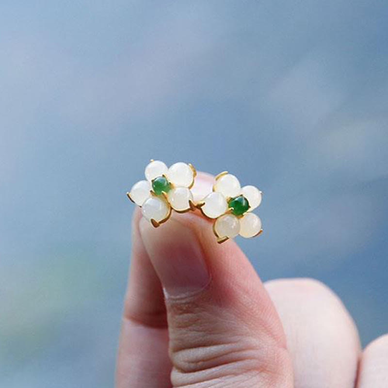 Pair of White Jade Flower Stud Earrings symbolizing harmony and gentle blessings | TheFuMaster