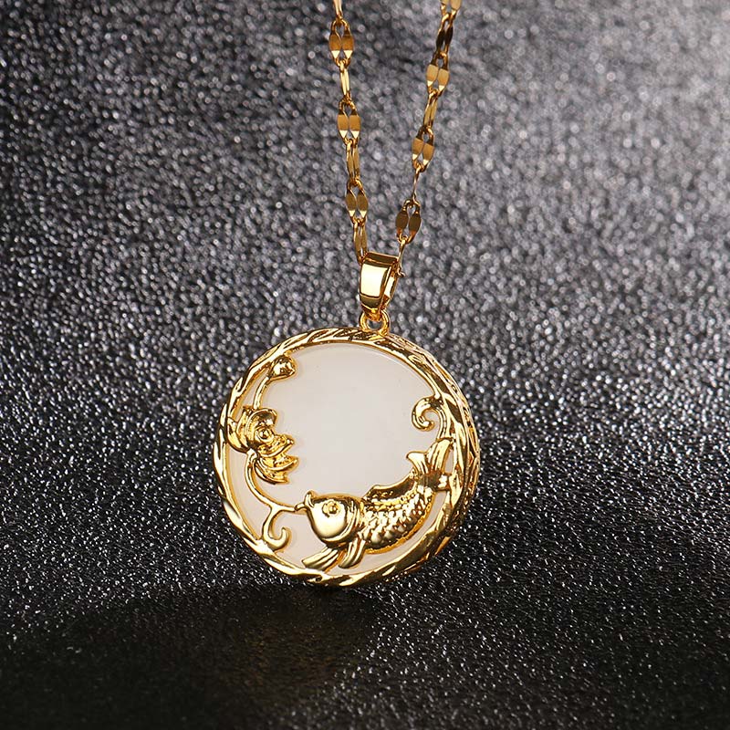 Close-up of white jade pendant with gold koi and lotus – handcrafted prosperity talisman by TheFuMaster
