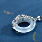 Flatlay display of TheFuMaster White Jade Koi Lucky Necklace for cleansing and balance
