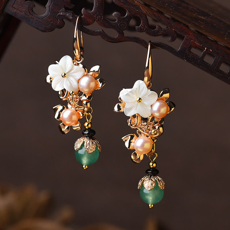 White tridacna stone flower earrings with bright green bead drops – TheFuMaster