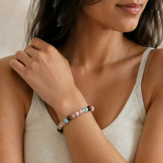 Wood pastel bead bracelet worn on the wrist