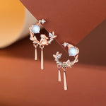 TheFuMaster Moon Flower Moonstone Earrings in rose gold, with delicate rabbit motif and glowing moonstone drops
