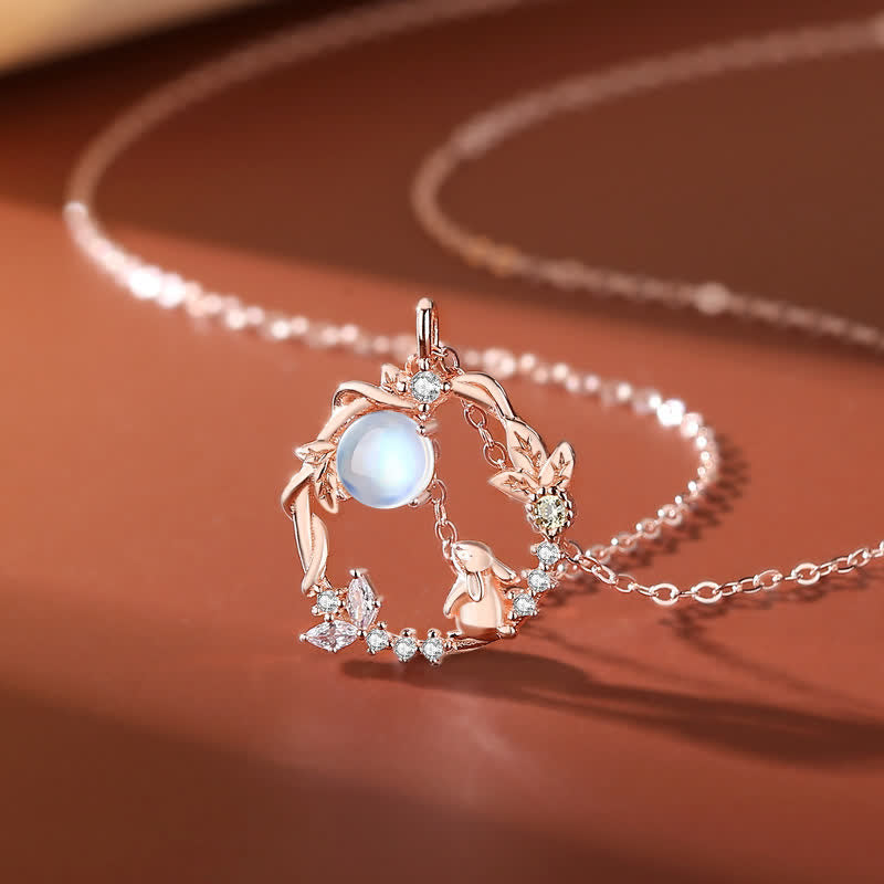 Close-up of TheFuMaster Moon Flower Moonstone Necklace in rose gold with rabbit motif and glowing moonstone pendant