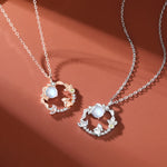 Two rose gold Moon Flower Moonstone Necklaces from TheFuMaster, reflecting soft light and elegant craftsmanship