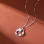 TheFuMaster Moon Flower Moonstone Necklace in silver, showing a cool-toned moonstone with subtle luster and elegant finish