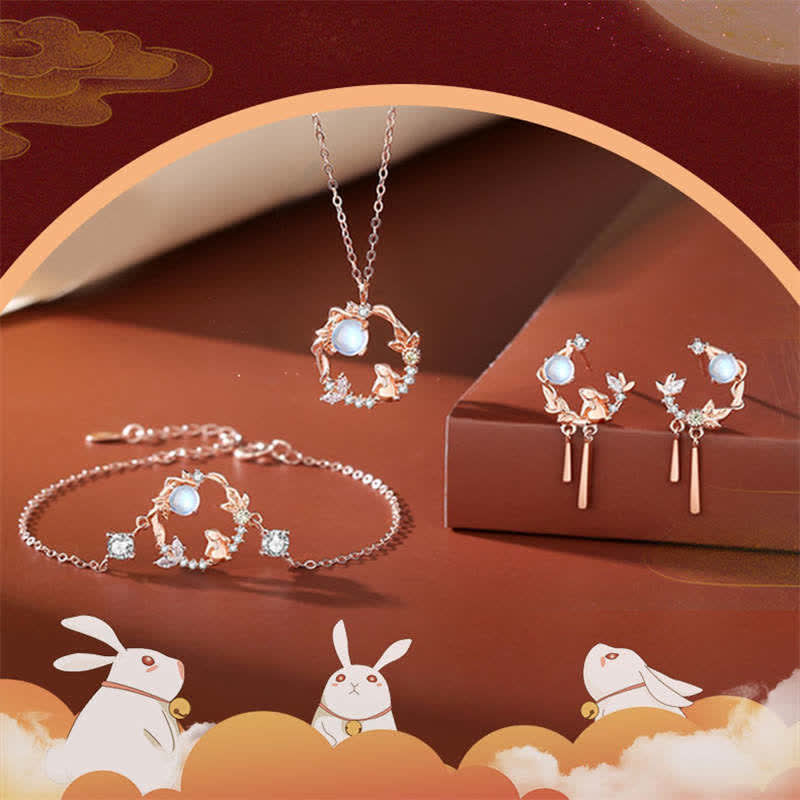 TheFuMaster Year of the Rabbit Moon Flower Moonstone Jewelry Set in rose gold — necklace, bracelet, and earrings displayed on warm peach background
